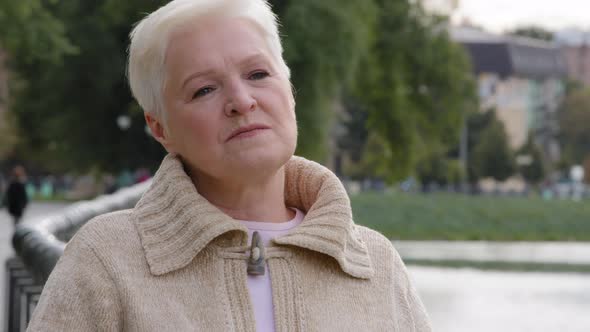 Closeup Sad Serious Attractive Woman of Retirement Age alt