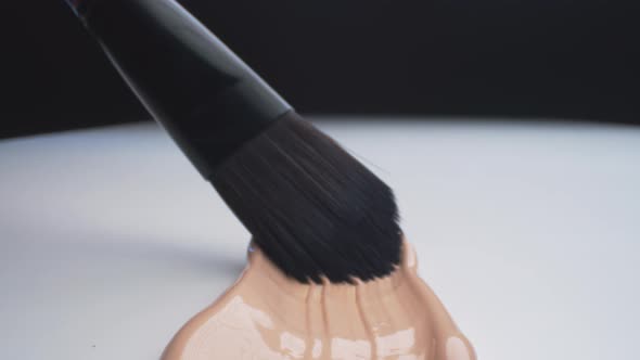 Beige Foundation Spreading Using Brush alt