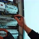 Electricians hands testing current  electric in control panel. - VideoHive Item for Sale