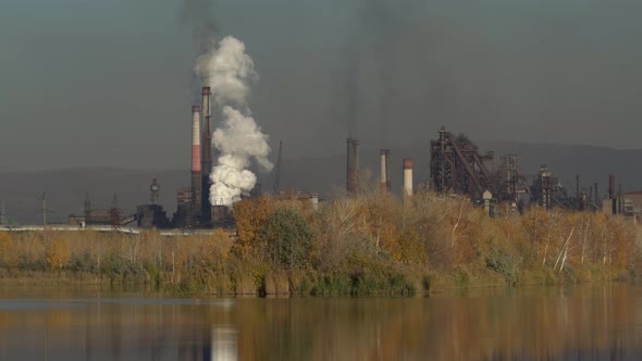 Air pollution from chimneys of an industrial plant alt