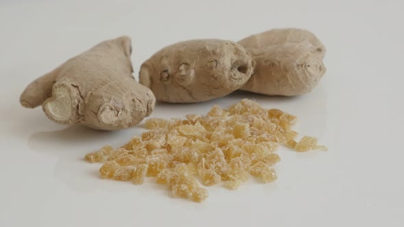 Slow tilt on sweet and candied  ginger root  4K 2160p 30fps UltraHD footage - Cubes of crystallized  alt