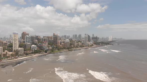 Drone dollying back from a costal city alt