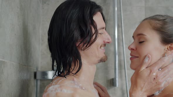 Girlfriend and Boyfriend Wahsing in Shower Kissing and Hugging Expressing Love alt