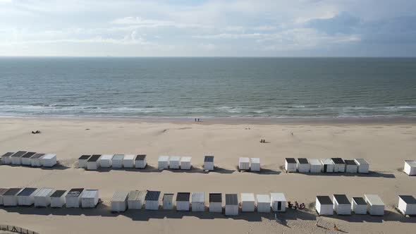 Flying over the beach with cabins. Cote d'Opale, northern France