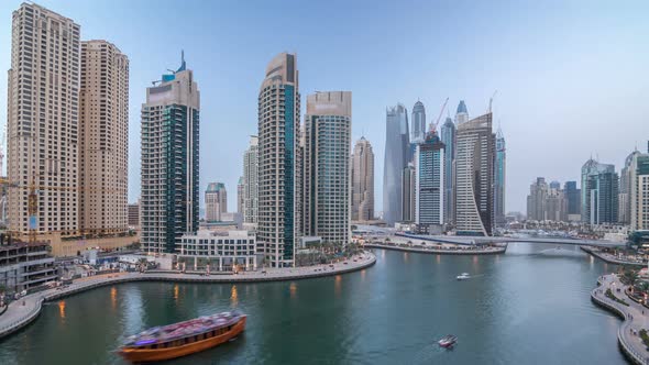 Beautiful Aerial Top View Day to Night Transition Timelapse of Dubai Marina Canal alt