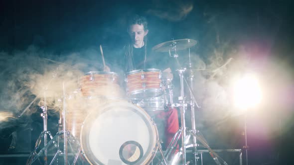 Professional Musician Is Hitting Drums and Cymbals in Clouds of Smoke alt