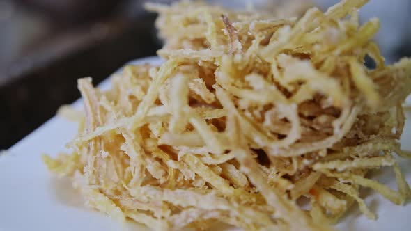 Crispy tempura fried Vitoria Regia plant strips for an organic treat harvested in the Amazon rainfor alt