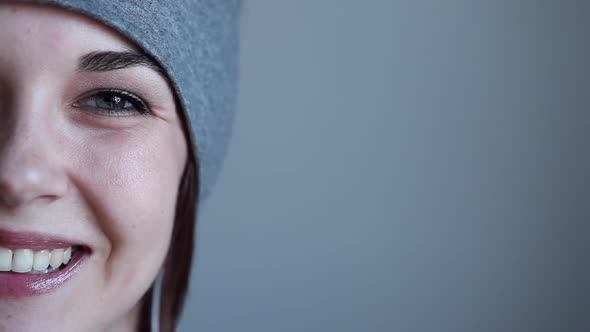 Beautiful Hipster Girl Looks up and Smiles to the Camera alt