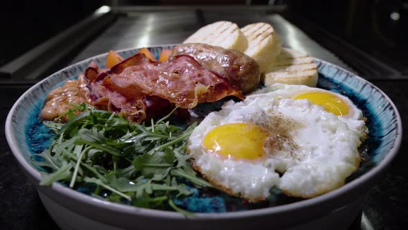 Fried Eggs with Sausages Toast and Arugula