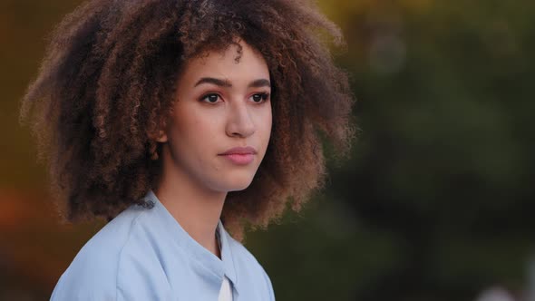 Closeup Serious Female Face Portrait Young Beautiful African Woman with Afro Hairstyle Sitting alt