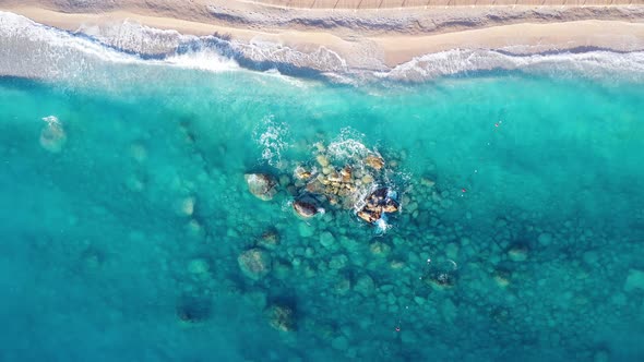 Aerial View of Blue Sea Rocks in Clear Water White Sandy Beach