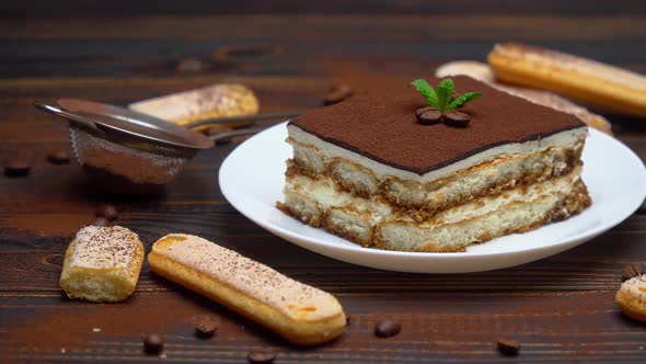 Portion of Traditional Italian Tiramisu Dessert Coffee Beans and Savoiardi Cookies alt