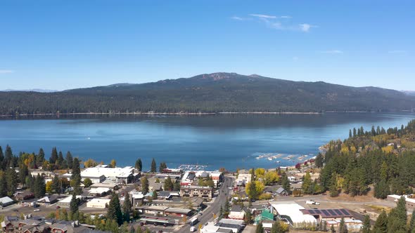 Wide aerial pulling away from the town of McCall in Idaho. alt