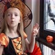Cute Caucasian Little Girl with Blonde Hair Seven Years Old in Witch Dress and Hat Having Fun and - VideoHive Item for Sale