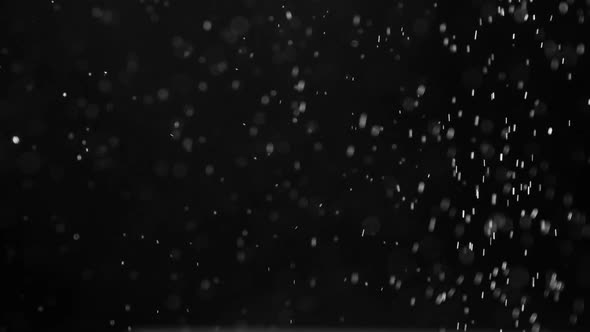 Falling White Microparticles alt