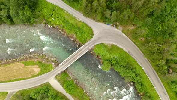 Short Road Bridge Over Flowing Watercourse. Geirangerelva In Geiranger, Norway. aerial top-down alt