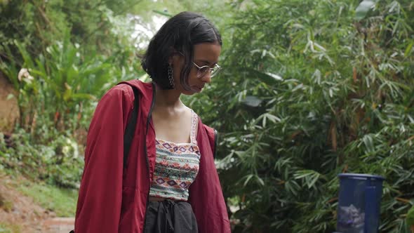 moody girl looking down natural park alt