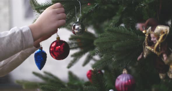 Hanging Christmas Decoration on Tree with Christmas Lights alt