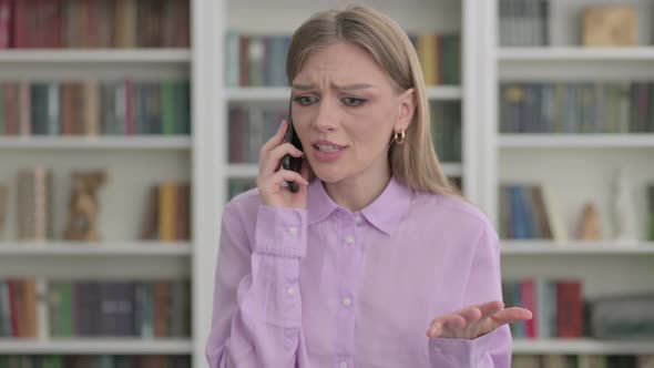 Portrait of Woman Talking Angrily on Smartphone alt