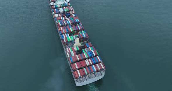 Aerial footage of sea freight ship sailing in Shenzhen city, China alt