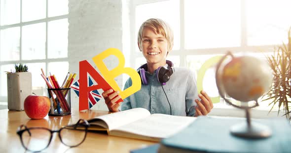 Boy Holding English Letters Portrait