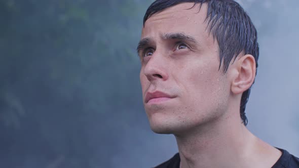 Man Looks Up at the Sky with Hope alt