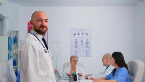 Portrait of Young Man Doctor Smiling at Camera alt