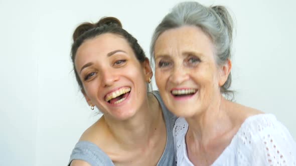 Happy Senior Mother is Hugging Her Adult Daughter the Women are Laughing Together Sincere Family of alt