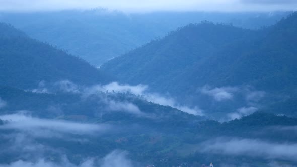 Landscape of foggy greenery rainforest mountains and hills