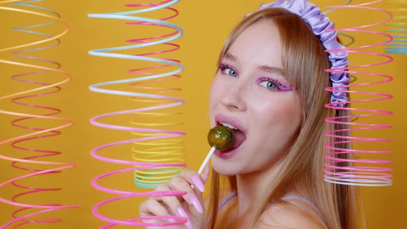 Sexy Girl Smiles Licks Round Caramel On Stick Stock Footage Videohive