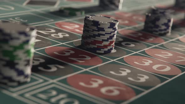 Roulette table with casino chips or tokens stacking on a bet. Timelapse. alt