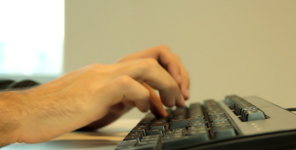 Man Typing on Keyboard (Tracking Shot)