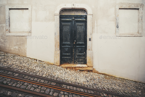 Abandoned house on a sloping street - Stock Photo - Images