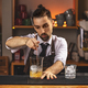 Barman stirring fresh alcoholic cocktail - PhotoDune Item for Sale