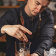 Young barman stirring fresh alcoholic cocktail - PhotoDune Item for Sale