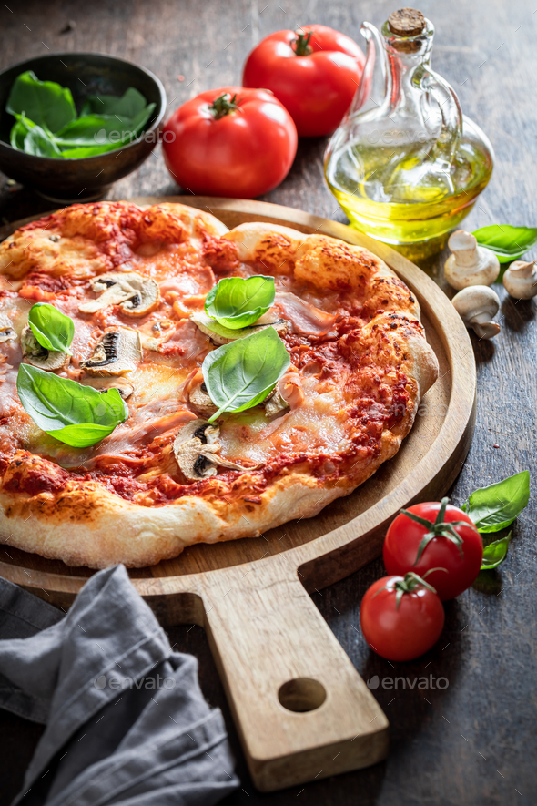 Hot Capricciosa pizza baked in the oven. Classic Italian cuisine. - Stock Photo - Images