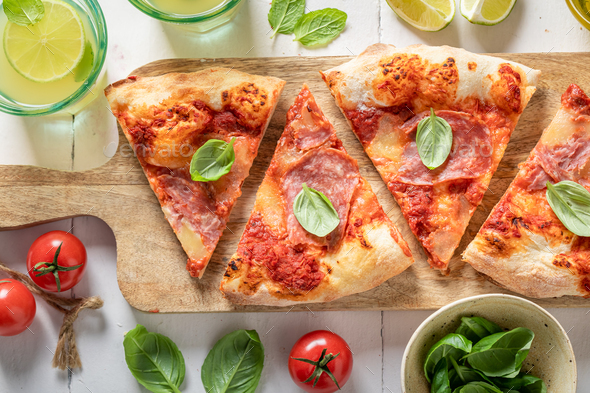 Traditional and fresh pizza with fresh ingredients. Poster for Restaurant. - Stock Photo - Images