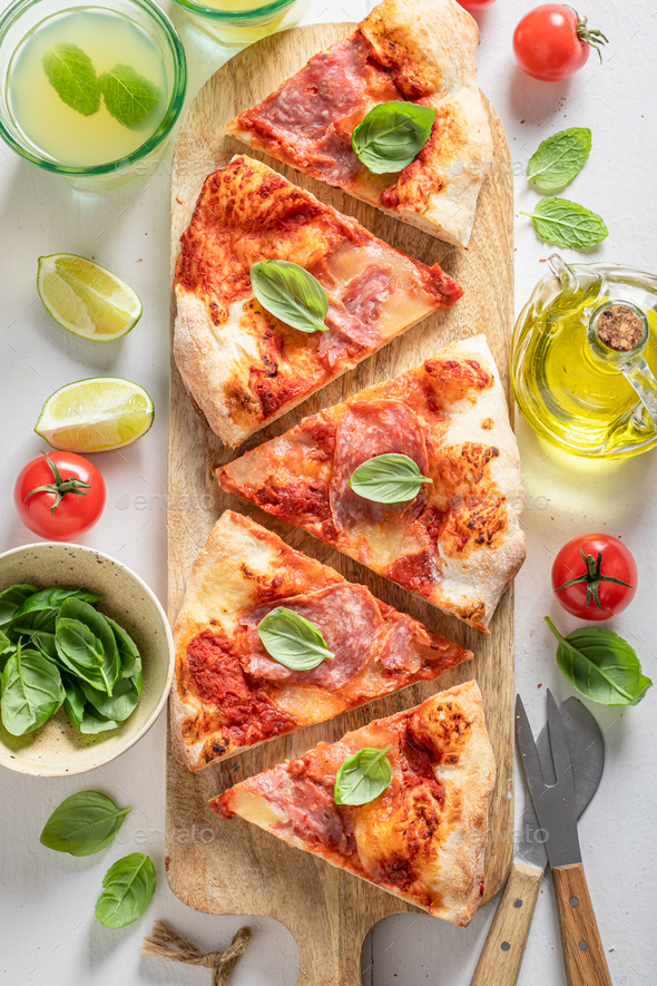 Homemade pizza baked in the oven. Classic Italian cuisine. Stock Photo