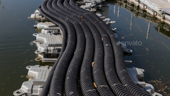 The main power cable installed with flexible cable conduit to Floating Solar PV System. Floating Pho