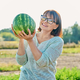 Smiling woman with ripe watermelon outdoor - PhotoDune Item for Sale