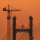 Silhouette of construction site and workers with sunset vibrant sky background - PhotoDune Item for Sale