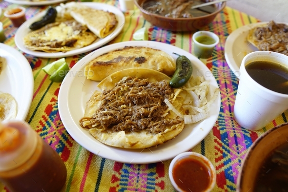 Mexican food known as birria tacos, birria quesadillas, and birria made  with sheep meat Stock Photo by wirestock