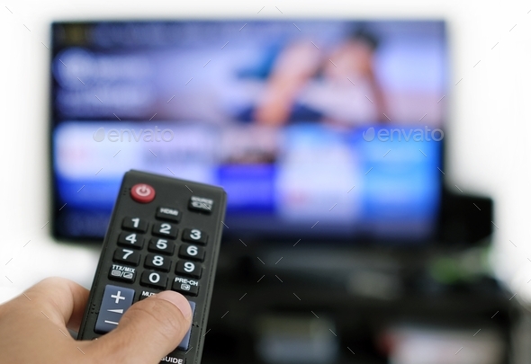 Remote control and screen - binge watching the favourite TV show - Stock Photo - Images