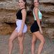 Young sporty girls wearing tight workout shorts and crop tops
