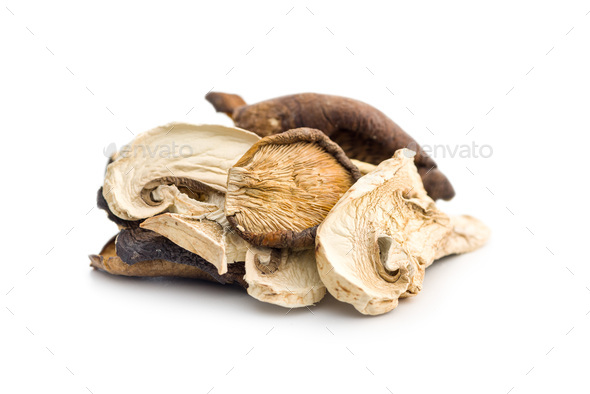 Various sliced dried mushrooms isolated on white background. - Stock Photo - Images