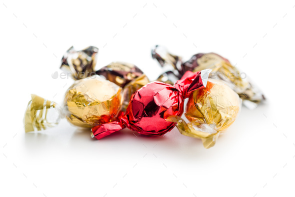 Sweet candy wrapped in foil isolated on white background. - Stock Photo - Images