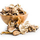 Various sliced dried mushrooms in bowl isolated on white background. - PhotoDune Item for Sale