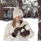 Caucasian woman holding Christmas present  in front of house - PhotoDune Item for Sale