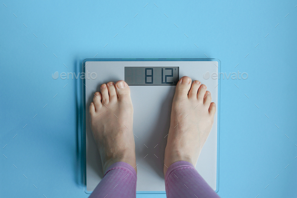 Woman watching her weight . Weight loss. Healthy weight. - Stock Photo - Images