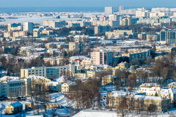panoramic aerial view of a winter city with a private sector and high-rise